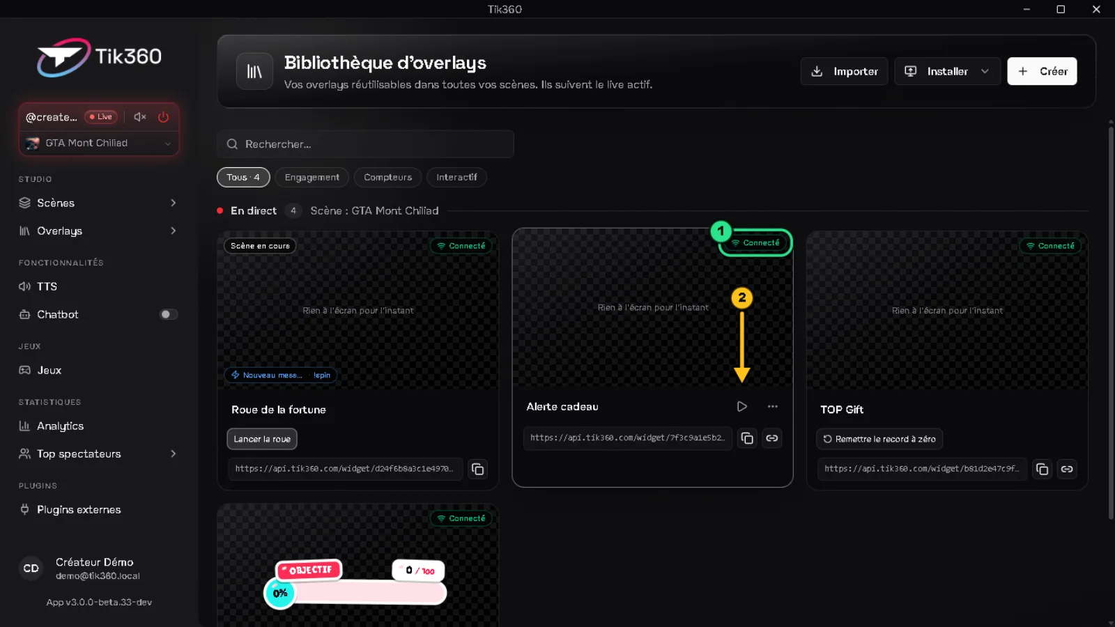 Bibliothèque pendant un live : le badge « Connecté » de l'Alerte cadeau est entouré en vert (1), une flèche 2 désigne le bouton ▶ de démo.